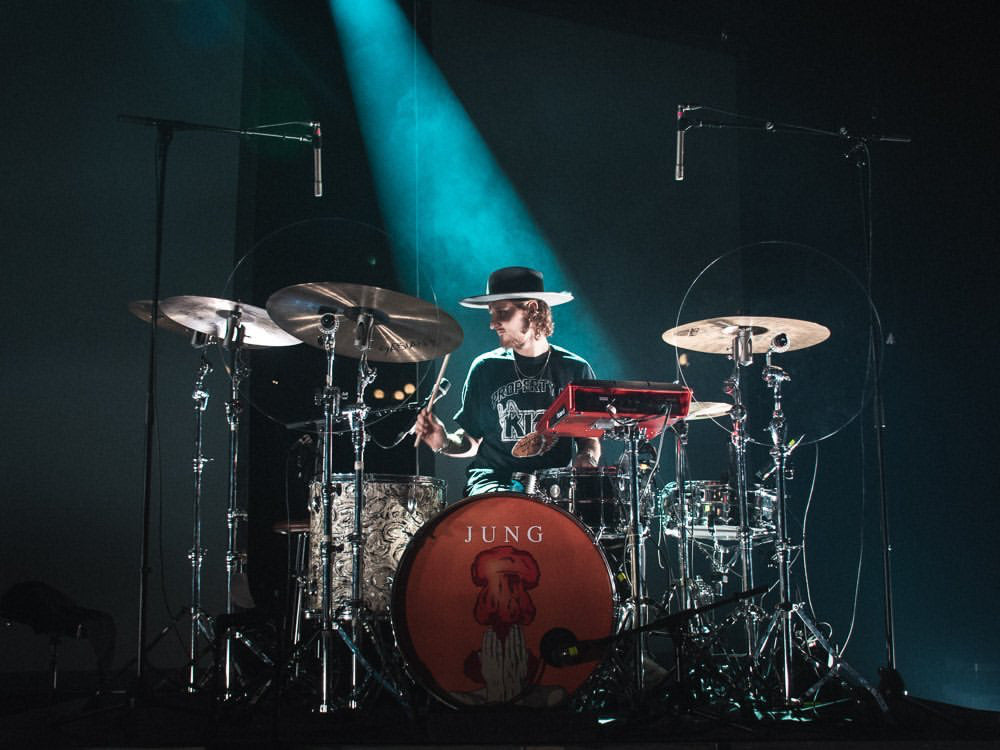 drum set with drummer with cymbal baffles on stands